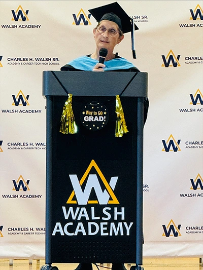 Dr. Ann Craig, Ed.D., addresses Walsh Academy's first graduates